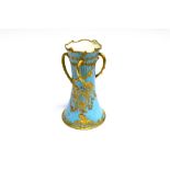 A LARGE ROYAL CROWN DERBY THREE HANDLED VASE of waisted form, floral and gilt decoration on a