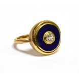 AN EARLY 20TH CENTURY GOLD, BLUE ENAMEL AND DIAMOND ROUND PANEL LATER ADAPTED AS A RING rub-over set