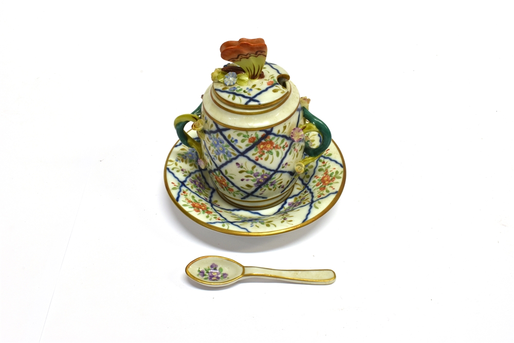 A CONTINENTAL CUP AND COVER ON SAUCER with matching spoon, with floral decoration and butterfly