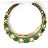 AN EARLY 20th CENTURY EMERALD AND DIAMOND CLOSED CRESCENT BROOCH IN VICTORIAN STYLE the ten