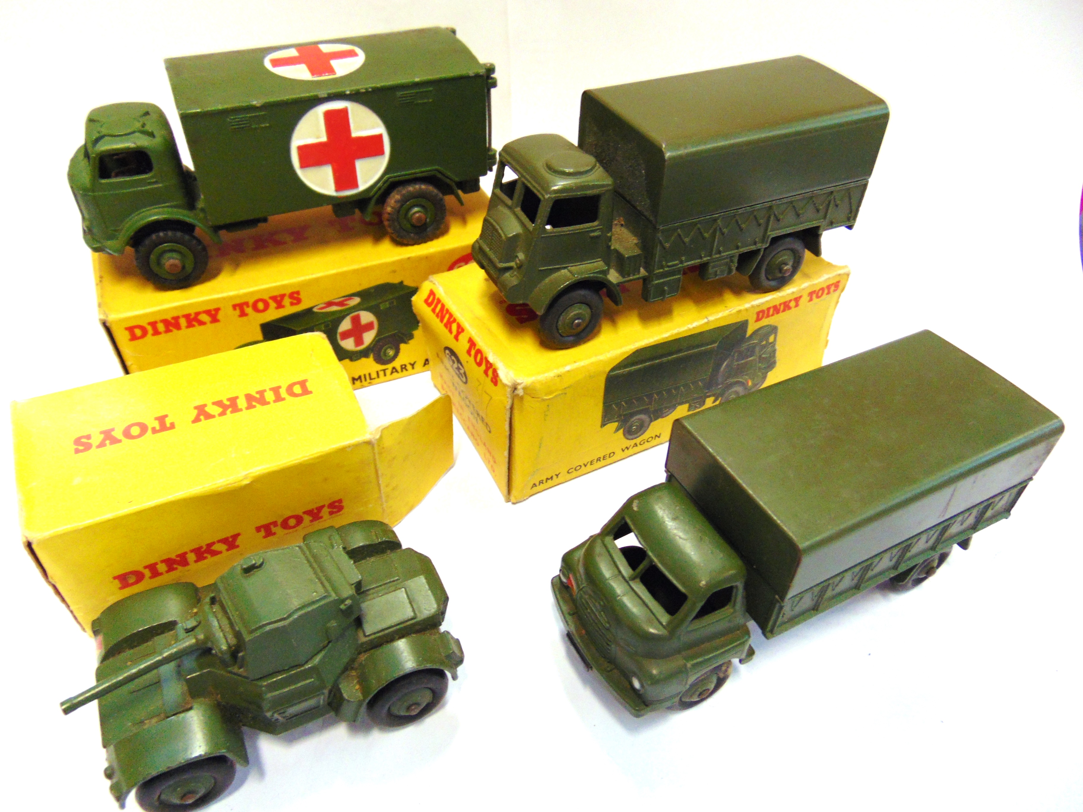 FOUR DINKY MODEL MILITARY VEHICLES comprising a No.626, Ford Military Ambulance, olive drab with