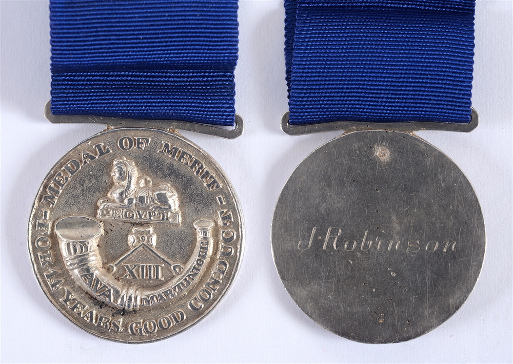 A RARE REGIMENTAL MERIT MEDAL OF THE THIRTEENTH LIGHT INFANTRY TO J. ROBINSON of solid silver