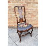 A QUEEN ANNE STYLE SINGLE DINING CHAIR with shaped splat back, drop-in needlework seat and shell