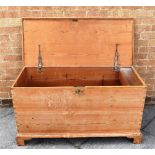 A LARGE PITCH PINE BLANKET BOX with candle bow to interior, on bracket feet, 115cm wide 51cm deep