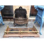 A CAST IRON FIRE BASKET 45CM WIDE and a brass and iron fender 92cm wide