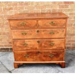 A WALNUT AND MAHOGANY CHEST OF TWO SHORT AND THREE LONG DRAWERS on bracket feet, 92cm wide 49cm deep