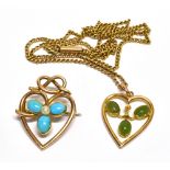 A LATE VICTORIAN GOLD AND GEM-SET OPEN-HEART BROOCH AND A SIMILAR PENDANT the brooch with a cabochon