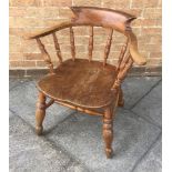 AN ELM AND BEECH SMOKER'S BOW ARMCHAIR on double-H shape stretcher base