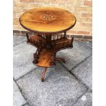 AN EDWARDIAN ROSEWOOD OCCASIONAL TABLE the circular top with inlaid decoration 47cm diameter, on