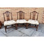 THREE MATCHING MAHOGANY DINING CHAIRS the pierced vase shaped splats relief carved with ears of