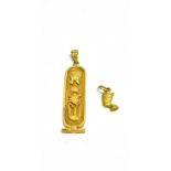 TWO EGYPTIAN GOLD PENDANTS comprising; a hieroglyph pendant, Egyptian mark, approx. 52mm high