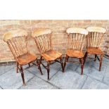 A SET OF FOUR SLAT BACK WINDSOR KITCHEN CHAIRS in turned supports