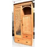 AN EDWARDIAN ASH MIRROR DOOR WARDROBE with carved decoration, 95cm wide 48cm deep 195cm high