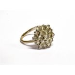 AN 18CT WHITE GOLD AND DIAMOND HEXAGONAL CLUSTER RING The 29 round brilliants approx. 1.62cts total,