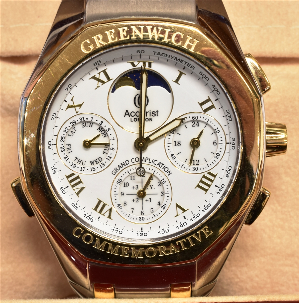 ACCURIST, GRAND COMPLICATIONS, A GENTLEMAN'S STAINLESS STEEL AND GILT QUARTZ BRACELET WATCH FROM '