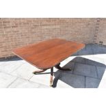 A 19TH CENTURY MAHOGANY TILT TOP BREAKFAST TABLE the oblong top 104cm x 152cm, on carved