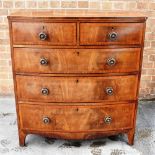 A MAHOGANY BOW FRONT CHEST OF TWO SHORT AND THREE LONG DRAWERS with crossbanded decoration on