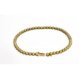 A MODERN 9CT GOLD AND DIAMOND TENNIS BRACELET the 50 small round brilliants approx. 1.00ct total,