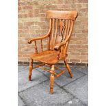 AN ASH AND ELM WINDSOR ARMCHAIR with pierced and shaped splat back, on turned supports with double