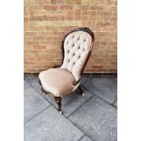 AN EDWARDIAN ROSEWOOD FRAMED SALON CHAIR with foliate carved decoration on cabriole supports