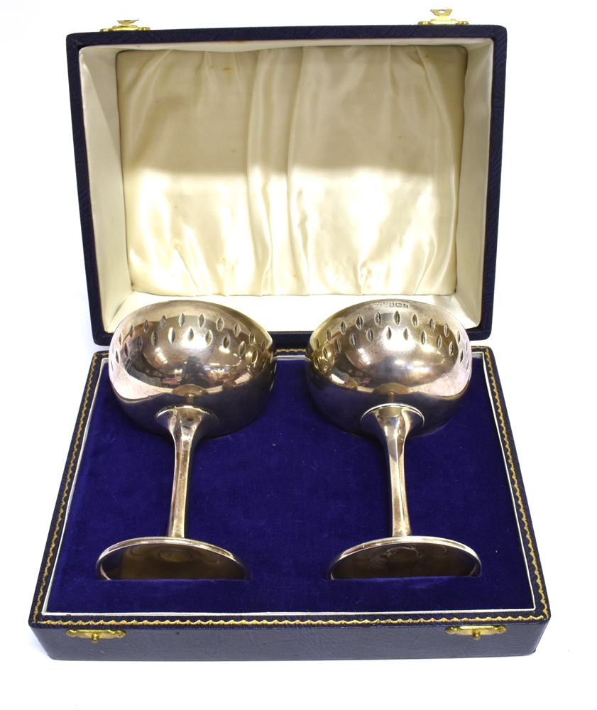 A PAIR OF MODERN SILVER GOBLETS each with a shallow round bowl with decorative sides, on a