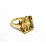 A 9CT GOLD AND RECTANGULAR CITRINE SINGLE STONE RING the step-cut stone approx. 16mm x 13.9mm, in