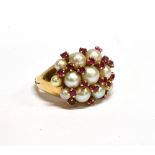 A RUBY AND CULTURED PEARL CLUSTER RING the 11 (of 13) graduated cultured-pearls arranged in three