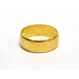 A 22CT GOLD BROAD WEDDING BAND approx. 7.4mm wide, Birmingham 1990, leading edge size R, 6.4g
