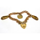 AN EARLY 20TH CENTURY ROSE GOLD CURB LINK BRACELET each link stamped '9' & '.375', on a later 9ct