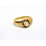 AN EARLY 20TH CENTURY GOLD AND DIAMOND SOLITAIRE GYPSY RING the cushion-shaped old-cut diamond