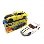 TWO DIECAST MODEL CARS comprising a Corgi No.345, M.G.C. GT, yellow with a black bonnet and boot