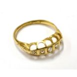 AN EARLY 20TH CENTURY 18CT GOLD AND ROSE DIAMOND FIVE STONE GYPSY RING each stone grain-set within a