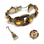 A VICTORIAN SILVER MOUNTED 'SCOTTISH PEBBLE' BRACELET, A SIMILAR SMALL BROOCH AND A GLOVE HOOK