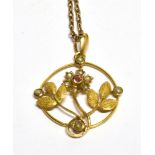 AN EDWARDIAN GOLD, HALF-PEARL AND SMALL GARNET OPEN FLORAL PENDANT AND CHAIN, AND OTHER ITEMS the