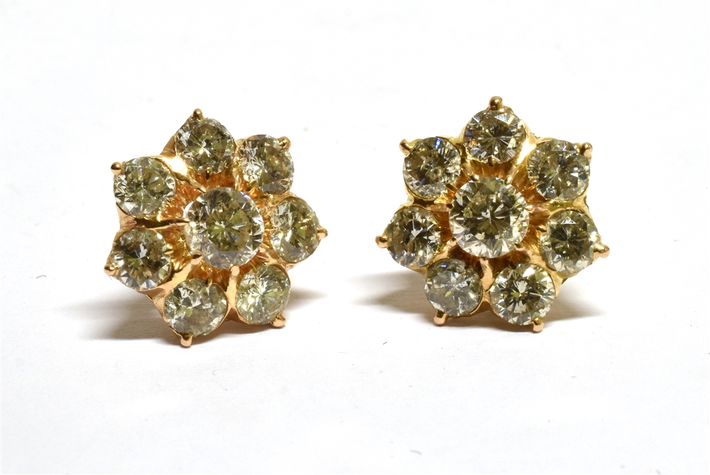 A PAIR OF DIAMOND FLOWER-HEAD CLUSTER STUD EARRINGS each claw set at the centre with a round - Image 3 of 4