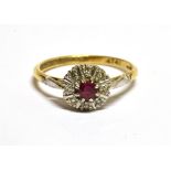 AN 18CT GOLD AND SMALL RUBY AND DIAMOND CLUSTER RING Centred with a small round mixed-cut ruby