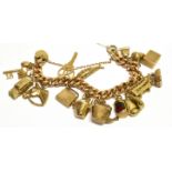 A VINTAGE 9CT GOLD HOLLOW-CURB 'CHARM' BRACELET on a padlock clasp, London 1961, and hung with