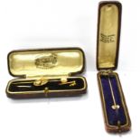 A COLLECTION OF STOCK PINS INCLUDING A VICTORIAN GOLD, RUBY AND DIAMOND STICK PIN IN THE FORM OF A