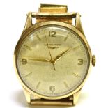 LONGINES, A GENTLEMAN'S 9CT GOLD ROUND BRACELET WATCH, CIRCA 1956 cream dial with baton numerals and