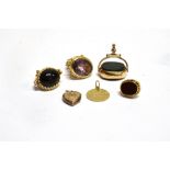 A COLLECTION OF GOLD AND GEM SET FOBS AND TWO PENDANTS comprising; an early 20th century 9ct gold,