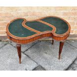 A SHAPED TOP MAHOGANY OCCASIONAL TABLE with tooled leather inset top, 76cm wide