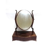 A MAHOGANY DRESSING TABLE MIRROR the serpentine front base fitted with three drawers, 47cm wide