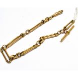 AN EARLY 20TH CENTURY GOLD FETTER AND THREE SHORT WATCH CHAIN The fetter links tamped '15', with a