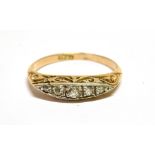 AN EARLY 20TH CENTURY SMALL DIAMOND FIVE STONE RING the graduated old-cut stones approx. 0.20cts