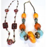 A BOLD ETHNIC MULTI-BEAD NECKLACE with five imitation-amber beads, four turquoise-coloured cabochon,