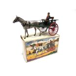 A BRITAINS FARM SERIES NO.20F, FARMER'S GIG green with red wheels, complete with a grey horse and