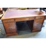 AN EDWARDIAN MAHOGANY TWIN PEDESTAL PARTNERS DESK with tooled red leather inset top, 152cm wide 91cm