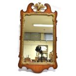 A PARCEL GILT PIER MIRROR top frame decorated with an eagle, 88cm high 46cm wide