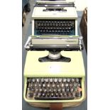 TWO TYPEWRITERS comprising an Olivetti Lettera 22, pale green, cased; and an Olivetti Dora, grey,