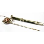 A VICTORIAN SCOTTISH PEBBLE BROOCH IN THE FORM OF A SCOTTISH BASKET HILTED BROADSWORD with a